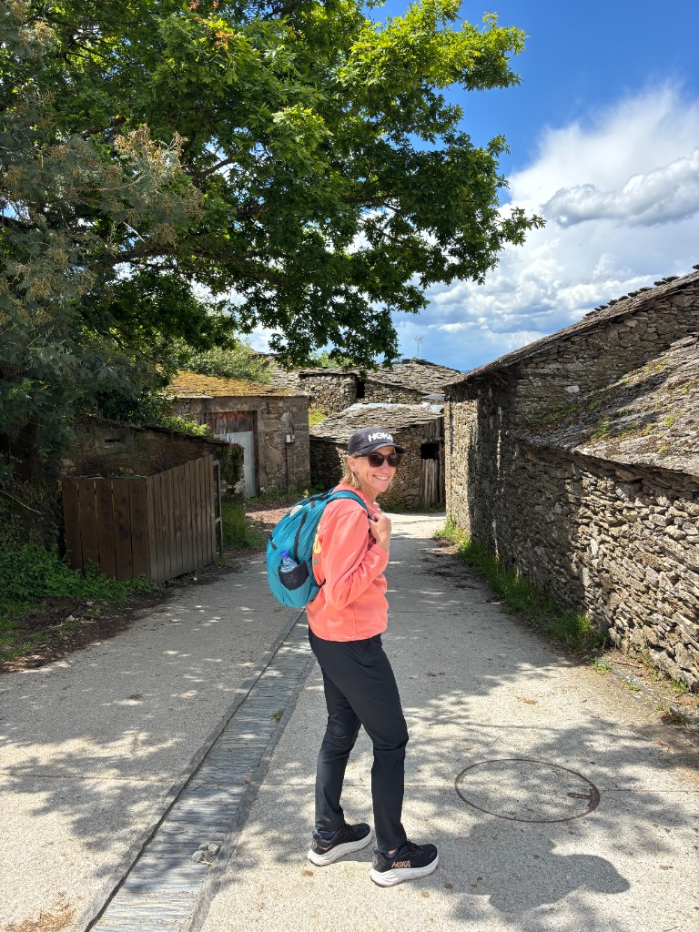 Stephanie on the trail, looking back and smiling